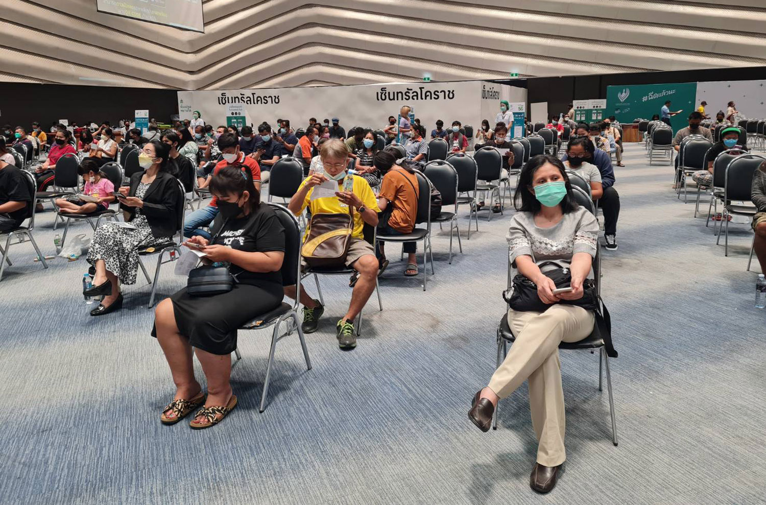 People wait to receive Covid-19 vaccine shots at CentralPlaza Nakhon Ratchasima shopping mall in Nakhon Ratchasima province. (Photo: Prasit Tangprasert)