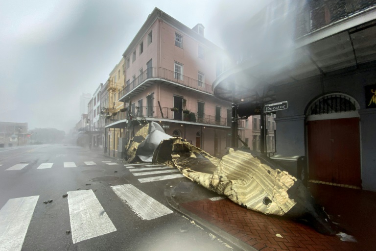 A section of a building's roof is blown off during rain and winds in the French Quarter of New Orleans on Sunday. A section of a building's roof is blown off during rain and winds in the French Quarter of New Orleans on Sunday.