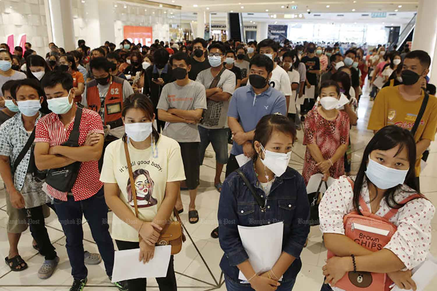 People wait for their turn to be vaccinated on Monday at Future Park shopping centre in Pathum Thani, a venue which is capable of inoculating up to 4,000 people a day. Pathum Thani is aiming to inoculate 1 million people. (Photo: Apichit Jinakul)