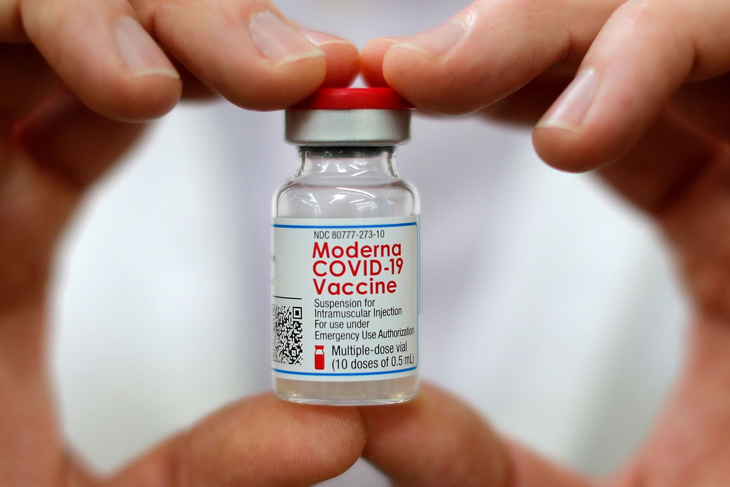 Walmart pharmacist holds a vial of the Moderna coronavirus disease vaccine inside a Walmart department store in West Haven, Connecticut, on Feb 17 this year. (Reuters photo)