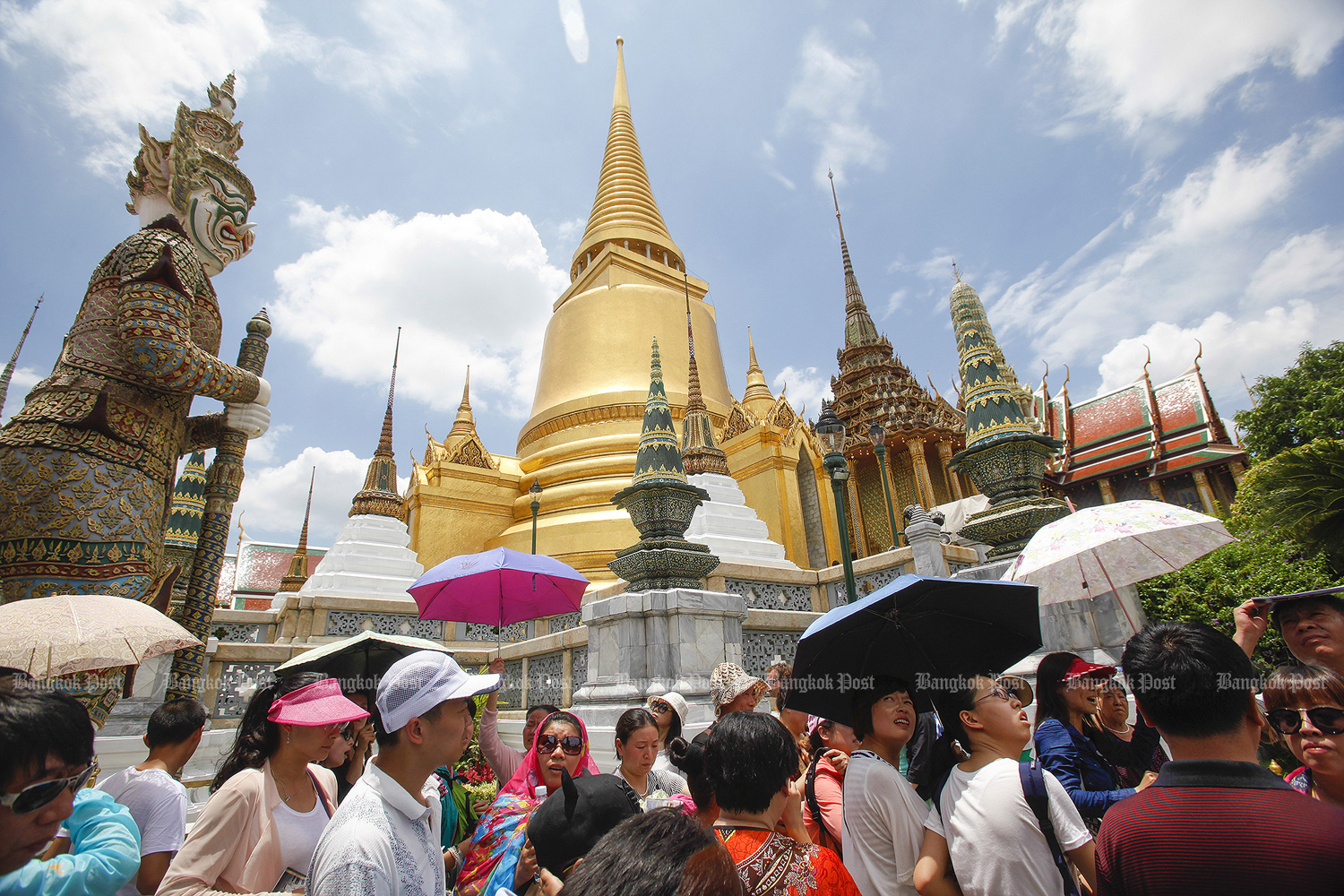 Visitors are seen at the Grand Palace. Thailand is now preparing to open more cities to tourism. (Bangkok Post file photo)