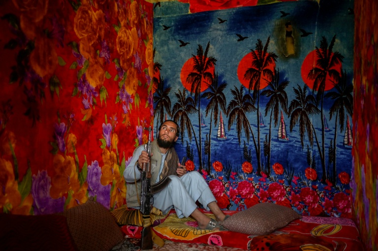 Wallpaper depicting tropical sunsets adorned the concrete walls of several cells Wallpaper depicting tropical sunsets adorned the concrete walls of several cells