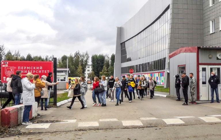Students fled the campus, while video footage showed some making phone calls to friends and family behind a cordon of police. Students fled the campus, while video footage showed some making phone calls to friends and family behind a cordon of police.