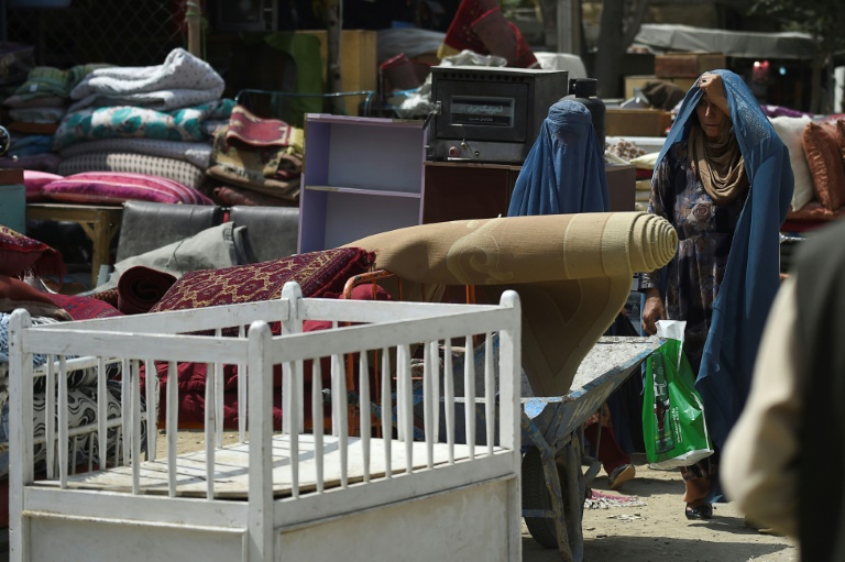 Afghan women have effectively been barred from work and school. Afghan women have effectively been barred from work and school.