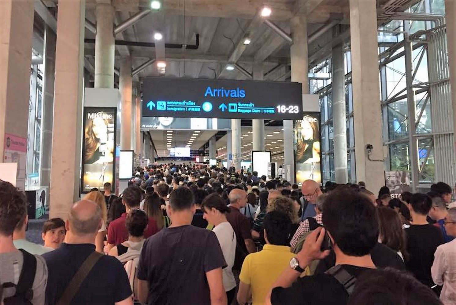 People wait to clear immigration outside the arrivals hall at Suvarnabhumi airport in 2017. Their personal information, along with that of millions of other travellers over the past decade, could be among the details exposed online. (file photo)