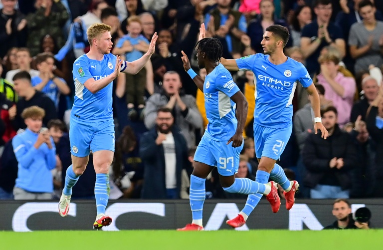 Manchester City midfielder Kevin De Bruyne (left) celebrates scoring against Wycombe.