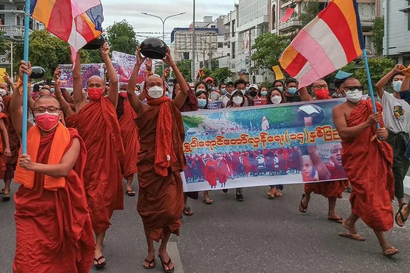 Pro-democracy monks and other supporters take part in a demonstration against the junta in Mandalay on Saturday, marking the 14-year anniversary of the 2007 Saffron revolution. (AFP photo) Pro-democracy monks and other supporters take part in a demonstration against the junta in Mandalay on Saturday, marking the 14-year anniversary of the 2007 Saffron revolution. (AFP photo)