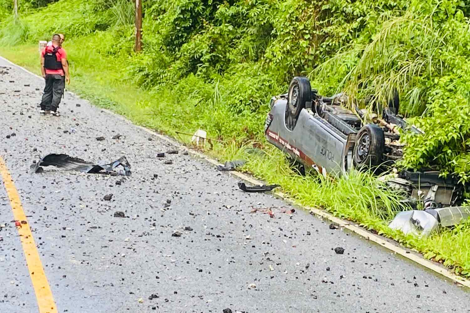 A police truck lies upside down following a bomb explosion in tambon Chang Phueak of Chanae district, Narathiwat, on Tuesday afternoon. (Photo supplied)