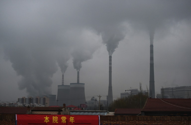 Smoke belches from a coal-fueled power station in China's northern Shanxi province in November 2015. Smoke belches from a coal-fueled power station in China's northern Shanxi province in November 2015.