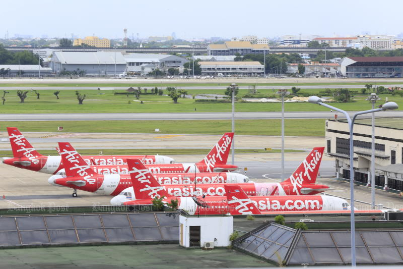 Aircraft of Thai AirAsia are seen parked at Don Mueang International Airport. (Photo: Pornprom Satrabhaya)