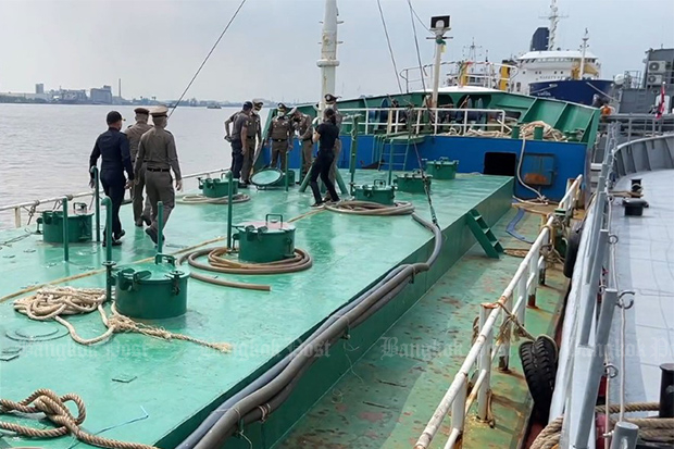 Police search the oil tanker MV Nua Samut 9, moored off Chon Buri province, on Saturday. (Photo: Prasit Tangprasert)