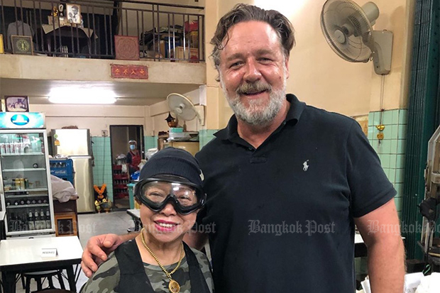 Jay Fai poses with Russell Crowe at her food shop, in a photo posted on her Instagram account on Wednesday night. (Photo: jayfaibangkok Instagram)