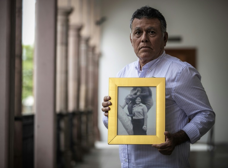 Roberto Martinez shows a picture of his sister Lourdes, who disappeared aged 23 in 1974 in Culiacan in northwest Mexico Roberto Martinez shows a picture of his sister Lourdes, who disappeared aged 23 in 1974 in Culiacan in northwest Mexico