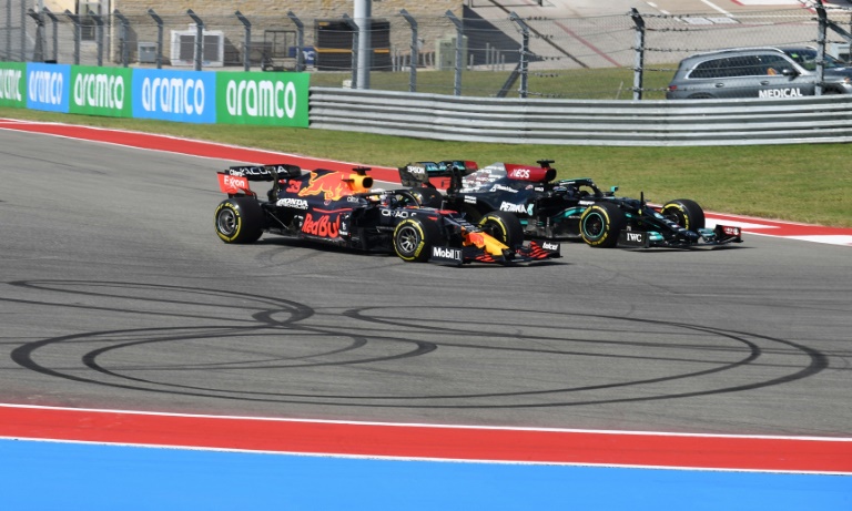Side-by-side: Max Verstappen (left) and Lewis Hamilton fight for the lead. Side-by-side: Max Verstappen (left) and Lewis Hamilton fight for the lead.