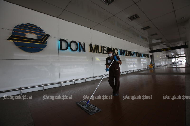 A worker cleans Don Mueang, one of the airports to reopen for fully vaccinated travellers on Monday. (Photo: Pattarapong Chatpattarasill)