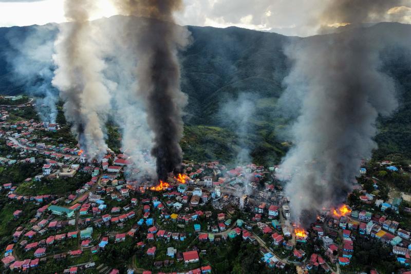 This aerial photo taken on Friday shows smoke and fires from Thantlang, in Chin State, where more than 160 buildings have been destroyed caused by shelling from junta military troops, according to local media. (AFP) This aerial photo taken on Friday shows smoke and fires from Thantlang, in Chin State, where more than 160 buildings have been destroyed caused by shelling from junta military troops, according to local media. (AFP)