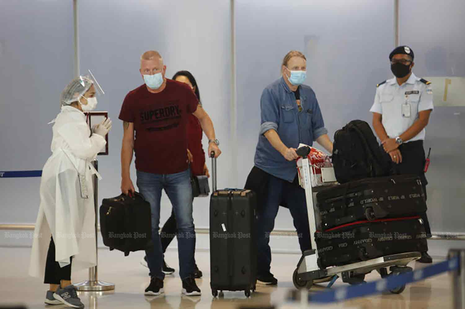 Travellers arrive at Suvarnabhumi airport in Samut Prakan province on Monday, when the country's reopening began. (Photo: Wichan Charoenkiatpakul)