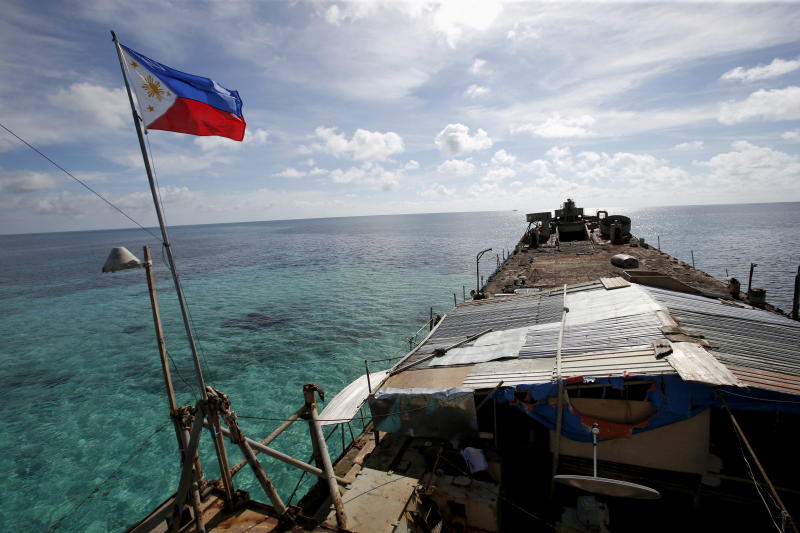 FILE PHOTO: A Philippine flag flutters from BRP Sierra Madre, a dilapidated Philippine Navy ship that has been aground since 1999 and became a Philippine military detachment on the disputed Second Thomas Shoal, part of the Spratly Islands, in the South China Sea March 29, 2014. (Reuters) FILE PHOTO: A Philippine flag flutters from BRP Sierra Madre, a dilapidated Philippine Navy ship that has been aground since 1999 and became a Philippine military detachment on the disputed Second Thomas Shoal, part of the Spratly Islands, in the South China Sea March 29, 2014. (Reuters)