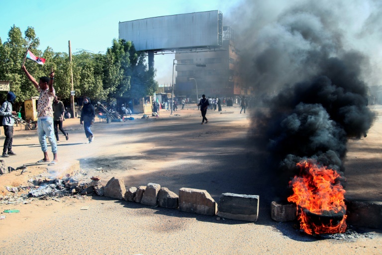 Sudan police fire tear gas as thousands protest in capital