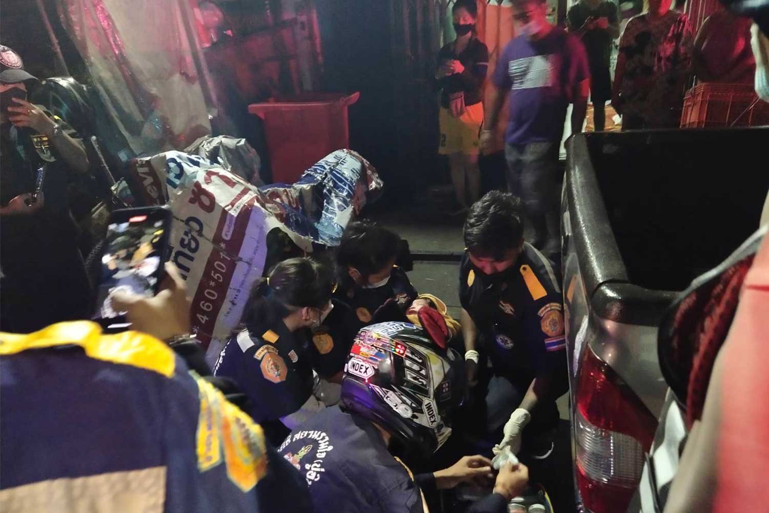 Rescue volunteers care for the newborn after lifting her from the garbage bin where she was found abandoned in Bang Kapi district, Bangkok, in the early hours of Tuesday. The baby's mother was found working nearby. Both were taken to hospital (Photo: Ruam Katanyu and Siam Ruamjai Pu-in rescue teams via kochasri radio centre)