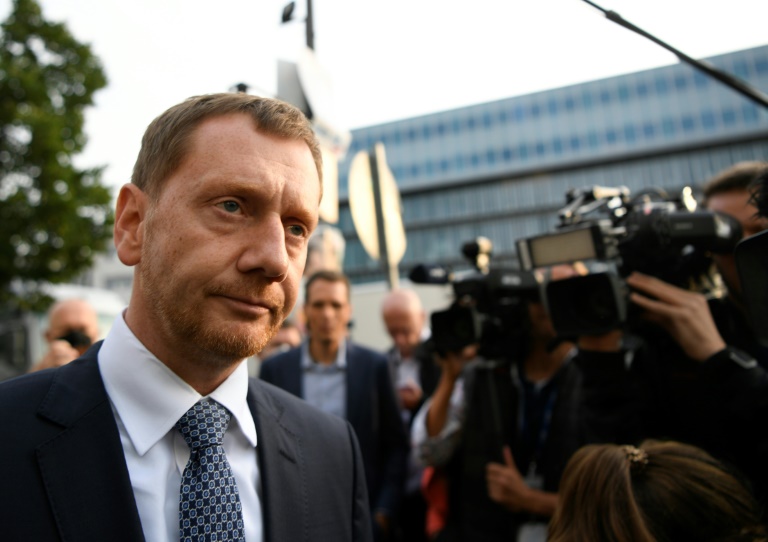 German police stage raids after threats to pro-vaccine politician