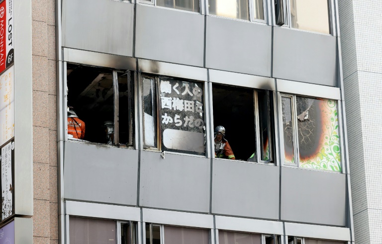 The charred interior of the fourth floor of the narrow office building was visible through broken and blackened windows. The charred interior of the fourth floor of the narrow office building was visible through broken and blackened windows.
