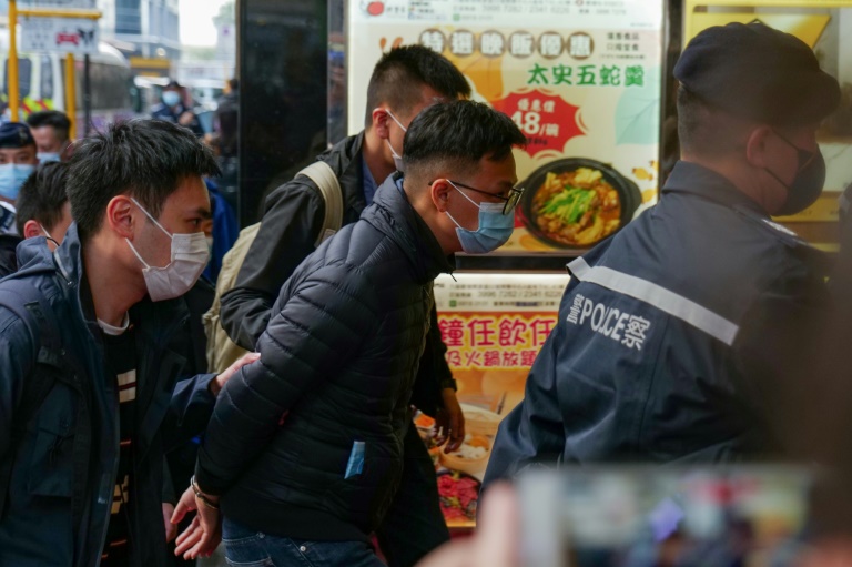 Hong Kong police have arrested six people linked to media outlet Stand News, including chief editor Patrick Lam (centre). Hong Kong police have arrested six people linked to media outlet Stand News, including chief editor Patrick Lam (centre).