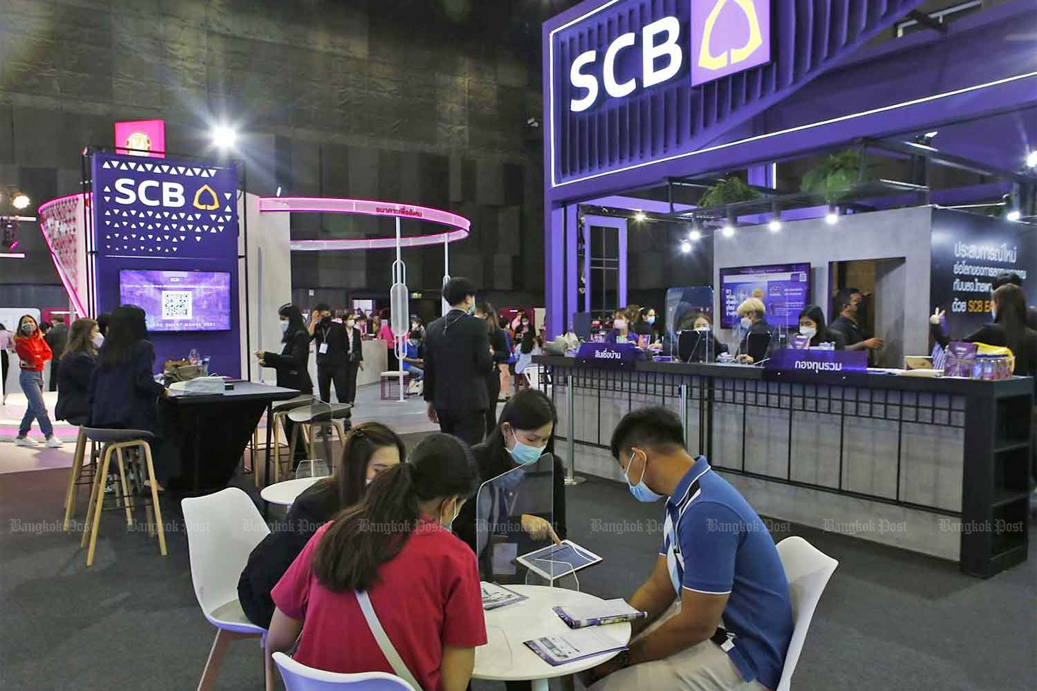 The Siam Commercial Bank booth at Thailand Smart Money 2021 at CentralWorld. (Photo: Apichit Jinakul)