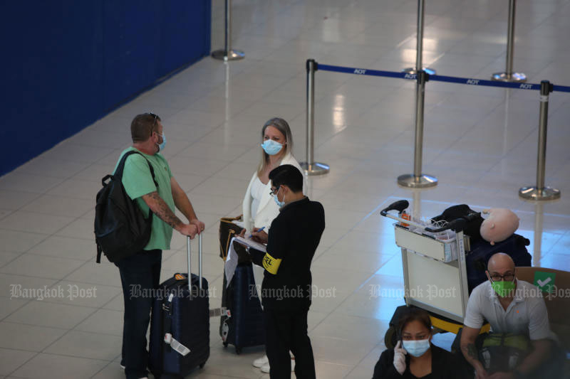 International passengers wait for a Covid-19 test upon arrival at Suvarnabhumi airport. The ‘Test & Go’ programme for those entering the kingdom has been suspended since Dec 22 because of the rising number of Omicron variant cases. (Photo: Varuth Hirunyatheb) International passengers wait for a Covid-19 test upon arrival at Suvarnabhumi airport. The ‘Test & Go’ programme for those entering the kingdom has been suspended since Dec 22 because of the rising number of Omicron variant cases. (Photo: Varuth Hirunyatheb)