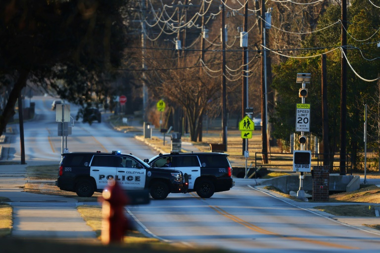 Police vehicles sit near Congregation Beth Israel Synagogue in Colleyville, Texas, some 25 miles (40 kilometers) west of Dallas, on January 16, 2022 Police vehicles sit near Congregation Beth Israel Synagogue in Colleyville, Texas, some 25 miles (40 kilometers) west of Dallas, on January 16, 2022