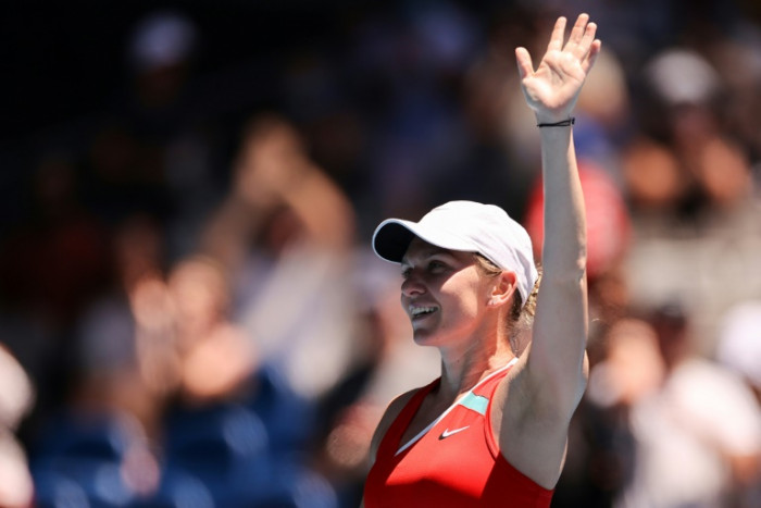 Resurgent Halep sweeps into last 16