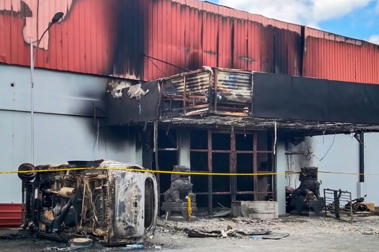 Indonesian police said 17 bodies were found in the Double O club in Sorong which caught fire during clashes between two groups while another person was stabbed to death Indonesian police said 17 bodies were found in the Double O club in Sorong which caught fire during clashes between two groups while another person was stabbed to death