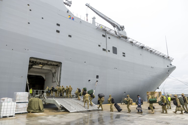 Members of the Australian Defence Force board the HMAS Adelaide in Brisbane earlier this month, before setting sail for Tonga. Members of the Australian Defence Force board the HMAS Adelaide in Brisbane earlier this month, before setting sail for Tonga.
