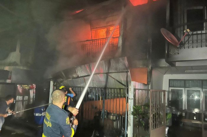 Two killed in house fire, wife badly burned