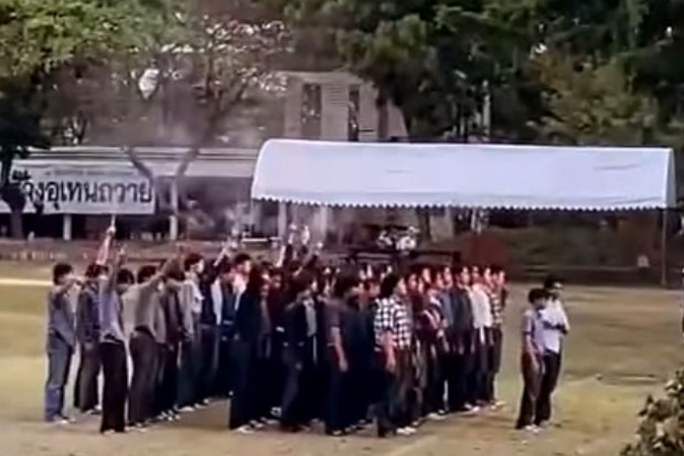 Some former and current students fire pistols into the air at the Uthenthawai campus of Rajamangala University of Technology Tawan-ok on Wedesday. (Photo: Archiwha News)