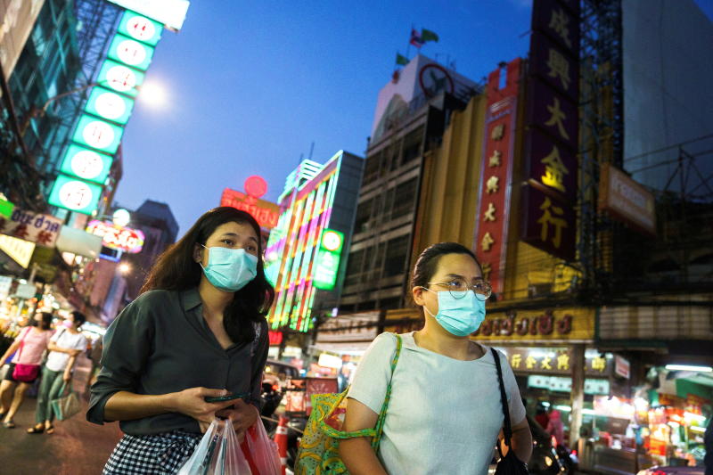 FILE PHOTO: People wearing face masks shop for street food in Chinatown amid the spread of the coronavirus disease in Bangkok, Jan 6, 2021. (Reuters)