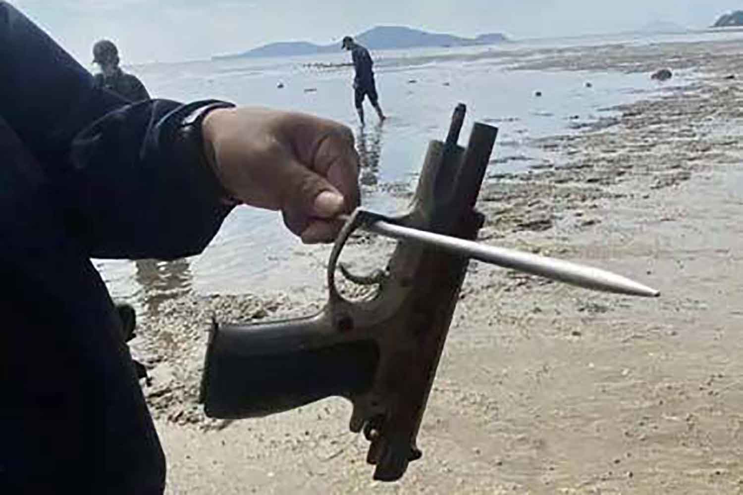 Police show one of the guns they believe was used to shoot Jimi Singh Sandhu. Police photo