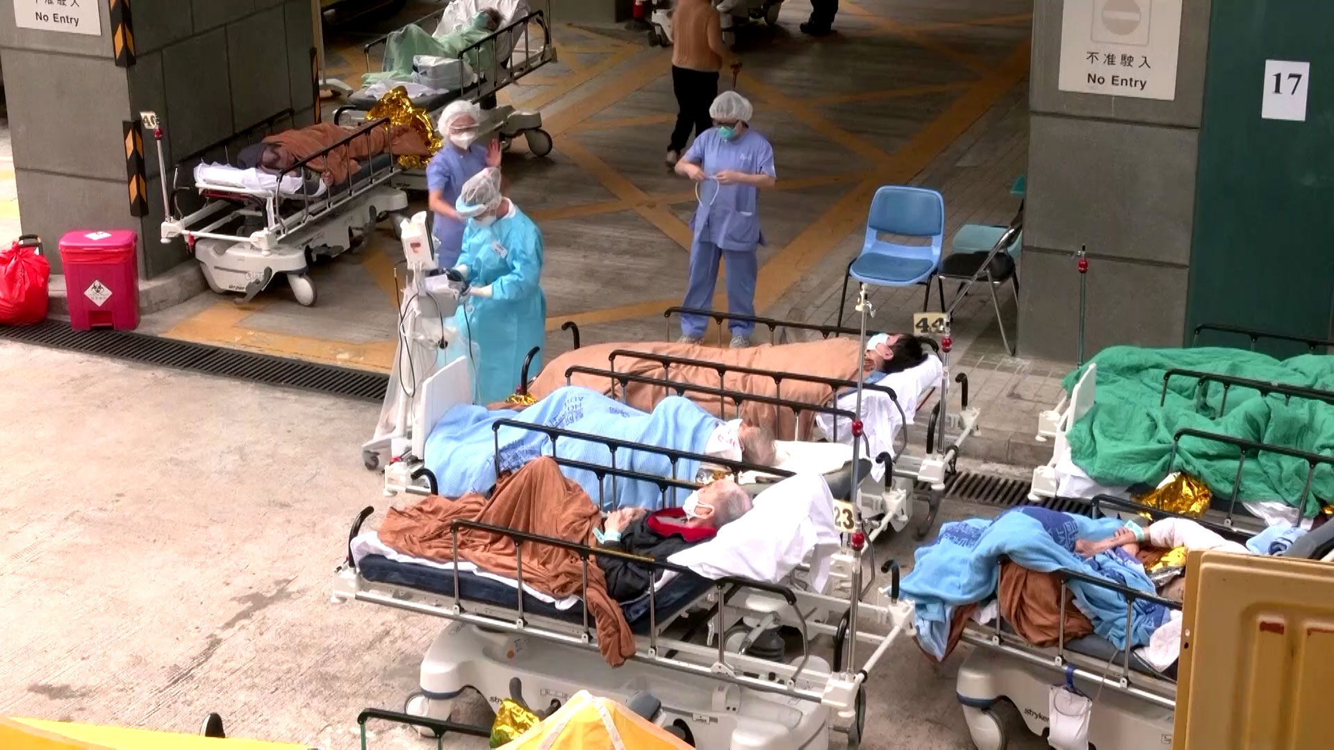 Dozens of Covid-19 patients in Hong Kong were being treated in makeshift open air spaces outside medical centers with several hospitals operating at over 100% capacity. - REUTERS