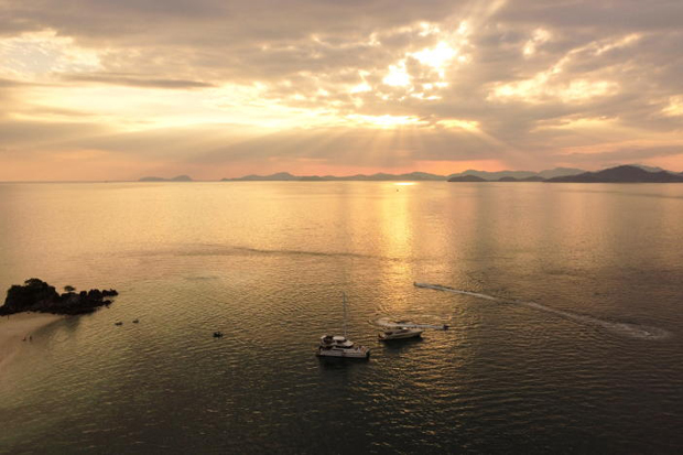 A sunset is pictured at Koh Khai Nok in Phuket province on Jan 3, 2022. (Reuters photo)