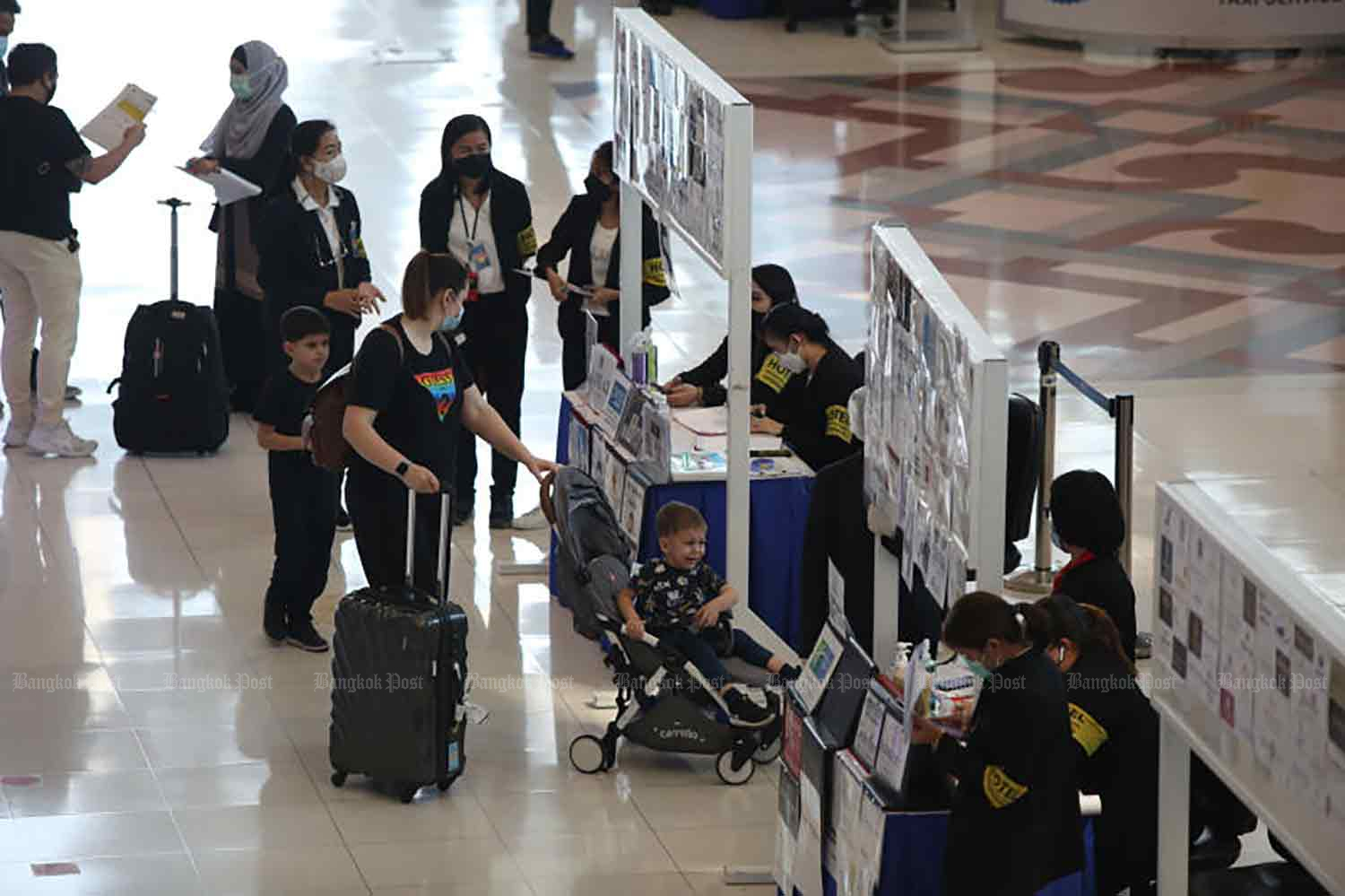 Visitors arrive at Suvarnabhumi airport early February 2022. (Photo: Varuth Hirunyatheb)