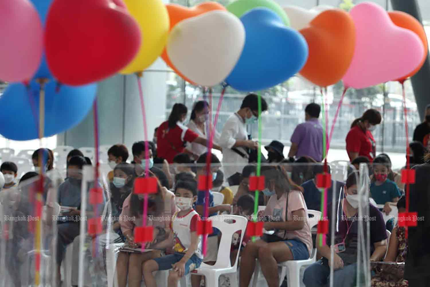 Colourful balloons brighten the Covid-19 vaccination venue for young children at Bang Sue Grand Station in Bangkok on Sunday. (Photo: Apichart Jinakul)