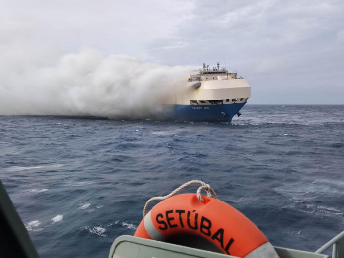 Fire dies down on ship carrying luxury cars