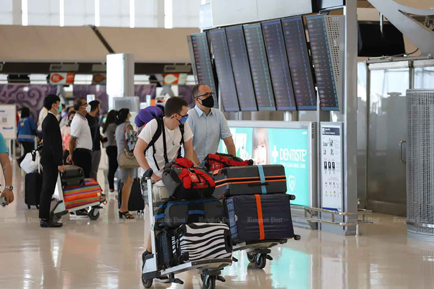 Travelers are at Suvarnabhumi airport in Samut Prakan province late last month. (Photo: Wichan Charoenkiatpakul)