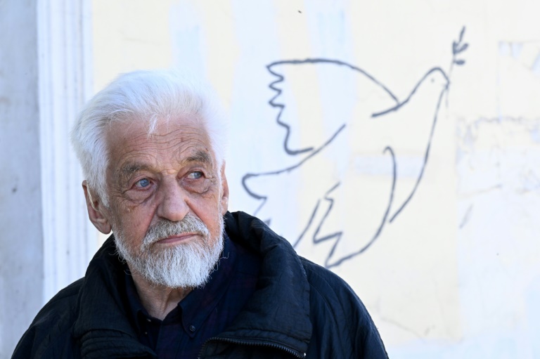 Russian artist Vladimir Ovchinnikov painted a blue-and-yellow Ukrainian flag on one side of a building, but it was covered over in white paint Russian artist Vladimir Ovchinnikov painted a blue-and-yellow Ukrainian flag on one side of a building, but it was covered over in white paint