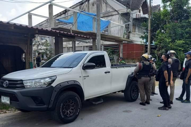 Police examine a pickup belonging to Abdultale Chapakiya parked at the construction site of a new house in Muang district of Yala province, where he was shot to death on Saturday. (Photo: Abdullah Benjakat)