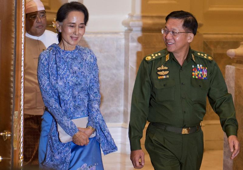 In this file photo taken on March 30, 2016, Aung San Suu Kyi, centre, and Myanmar's military chief Senior General Min Aung Hlaing, right, arrive for a handover ceremony at the presidential palace in Naypyidaw.(Photo: AFP)