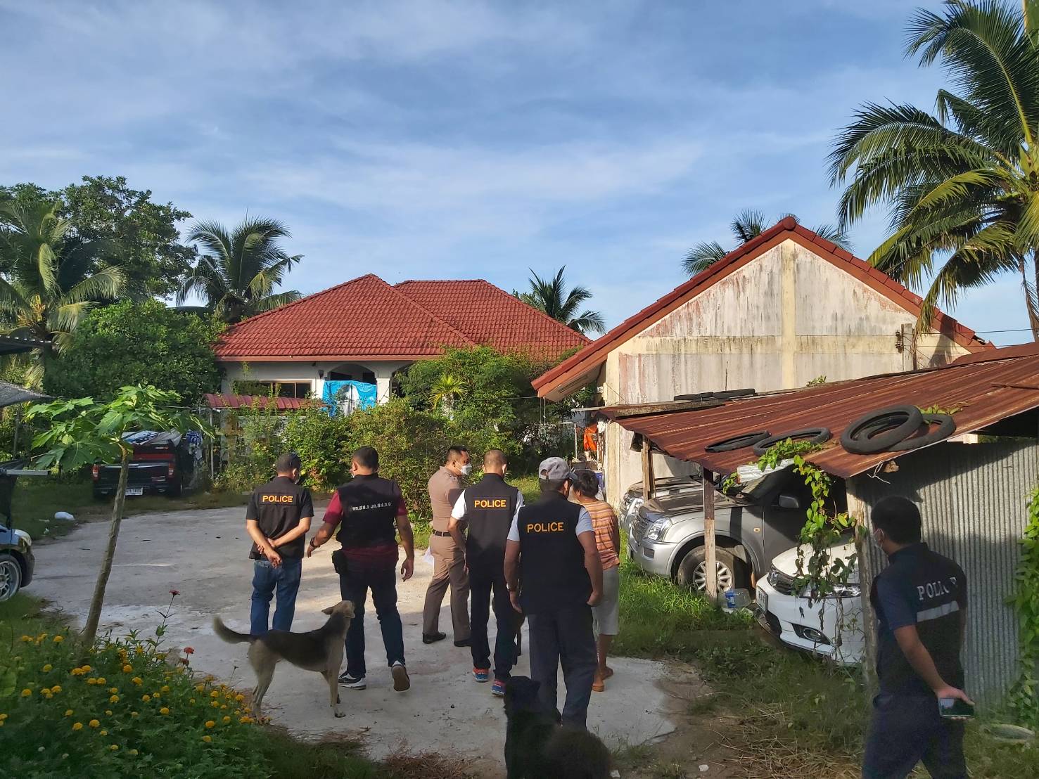 Police raid a house used as an office for operating illegal mortgage and money lending services in the southern province of Songkhla on Tuesday. (Photo supplied)