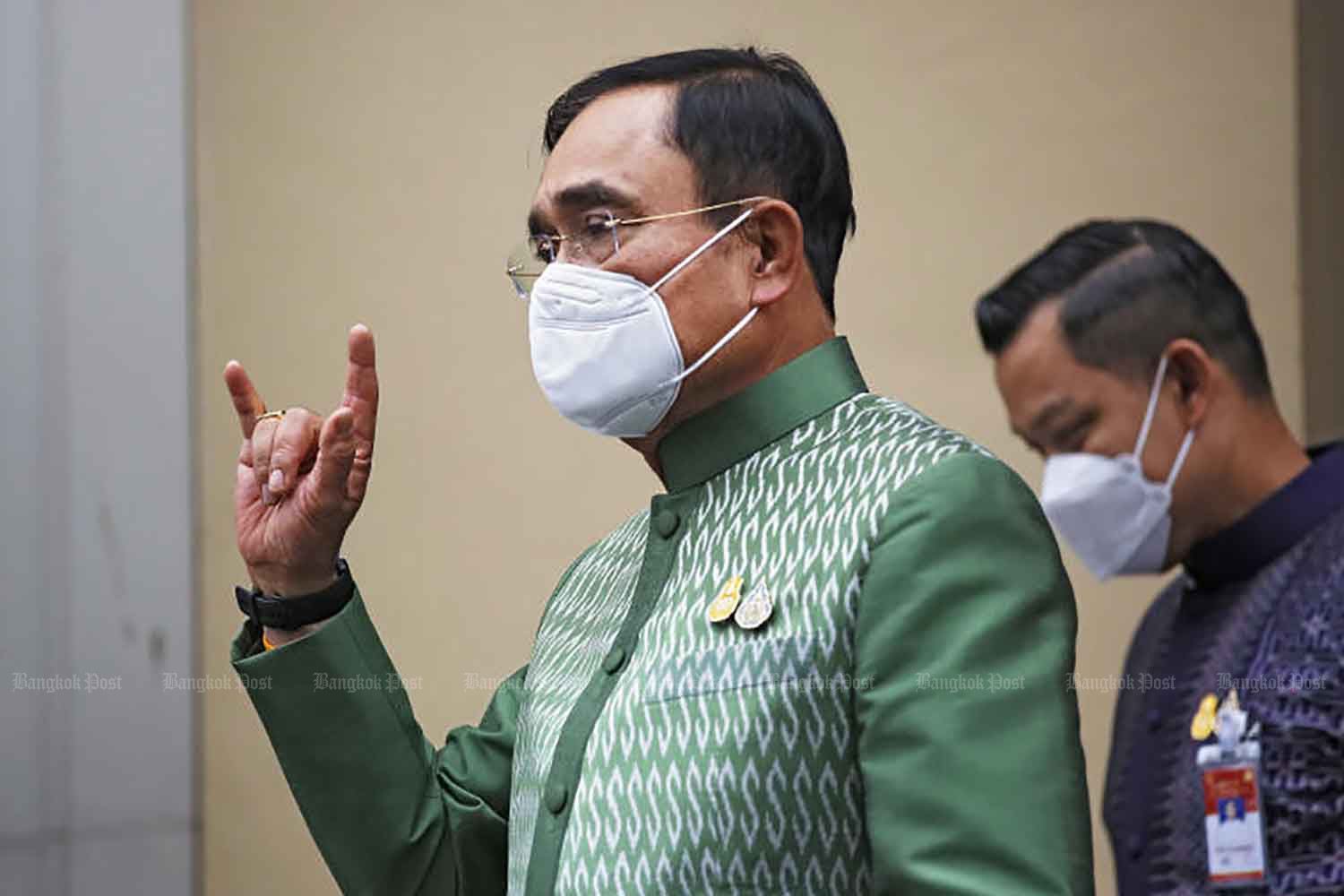 Prime Minister Prayut Chan-o-cha shows a love hand sign after chairing a cabinet meeting at Government House on May 3. (Photo: Arnun Chonmahatrakool)