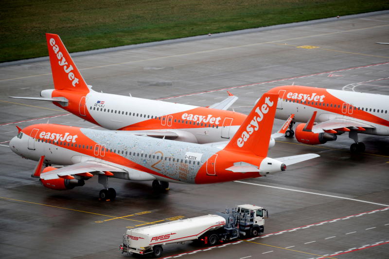 FILE PHOTO: EasyJet airplanes are parked on the tarmac during the official opening of the new Berlin-Brandenburg Airport (BER) FILE PHOTO: EasyJet airplanes are parked on the tarmac during the official opening of the new Berlin-Brandenburg Airport (BER)