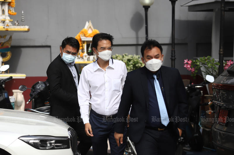 Former Democrat Party deputy leader Prinn Panitchpakdi, centre, arrives at the Huai Khwang police station in Bangkok on May 5 to acknowledge a molestation charge. (Photo: Nutthawat Wicheanbut)